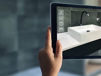 Augmented Reality bathroom planning. Sanitary ware. Hand holding digital tablet in real home background, AR application. A new way to experience products. Schlagwort(e): augmented reality, product, simulation, digital, application, business, mobile, technology, hand, consumer, smart, interior, modern, design, bathroom, service, buying, planning, customer, future, home, lifestyle, marketing, ar, augmented, media, sink, clean, view, tablet, simulate, experience, screen, commercial, interactive, virtual, access, shop, concept, detail, reality, check, phone, wash, sanitary ware, bathtub, modern, interior, ceramic, basin, decoration, ar, augmented reality, simulation, digital, application, business, mobile, technology, hand, consumer, product, smart, interior, modern, design, bathroom, service, buying, planning, customer, future, home, lifestyle, marketing, augmented, media, sink, clean, view, tablet, simulate, experience, screen, commercial, interactive, virtual, access, shop, concept, detail, reality, check, phone, wash, sanitary ware, bathtub, ceramic, basin